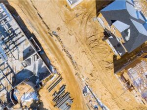 Aerial view of a residential subdivision with multiple building lots and development underway in Lehi Utah.